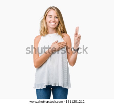 Beautiful young elegant woman over isolated background Swearing with hand on chest and fingers, making a loyalty promise oath