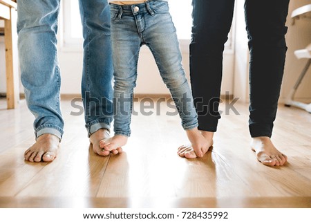 Similar – feet of a man standing inside a big puddle after a heavy rain