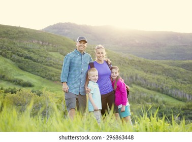 A Beautiful Young Family Hiking On A Nice Scenic Evening In The Rocky Mountains Of Utah In The United States Of America