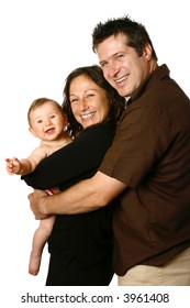 Beautiful Young Family, Side View With Mother Holding Laughing Baby.