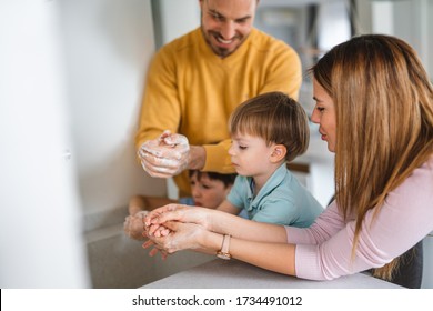 Beautiful Young Family Are Washing Their Hand. Protection Against Infection And Virus.