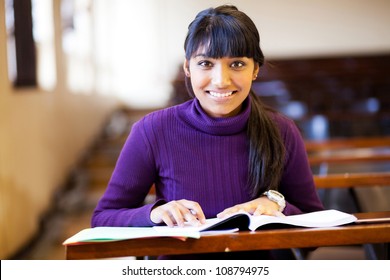 beautiful young female college student in classroom