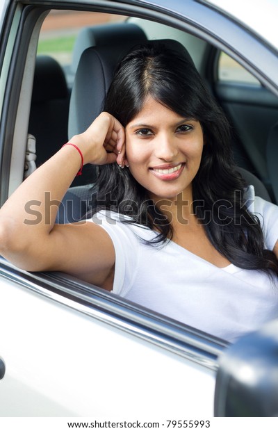 beautiful young female\
driver inside a car