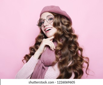 Beautiful Young Female Model With Long Wavy Hair Wearing Pink Beret , Scarf And Eyeglasses, Close Up