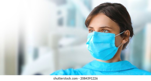 Beautiful Young Female Nure Wear Medical Protective Mask. Dentist Coronavirus Prevention Medical Surgical Masks. Wide Banner Copy Space For Text.