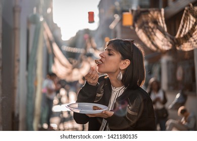 Beautiful Young Female Tourist In City Of Paris France Enjoying Holidays In Beautiful Little Street Festival Eating Street Food