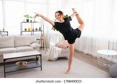 Beautiful Young Fitness Woman Or Ballet Dancer At Home, Doing Gymnastics Exercises In Living Room. Copy Space