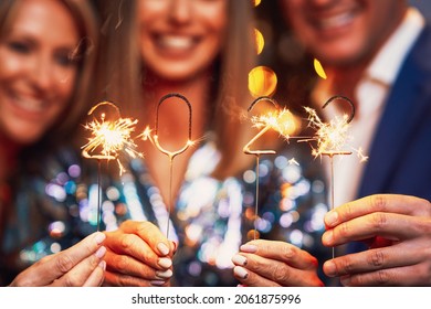 Beautiful young friends having fun at New Year's Eve Party 2022