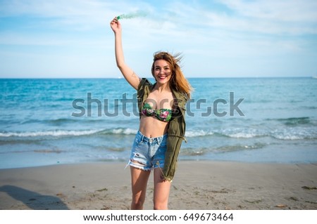 Beautiful young girl at the beach
