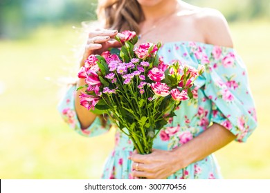 Beautiful  Young Girl With A Bouquet Of Flowers