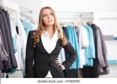 The beautiful young girl in clothes shop - Shutterstock ID 47583595