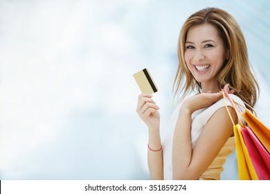 Beautiful young girl with credit card