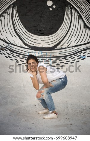 Woman at the window of a parking garage