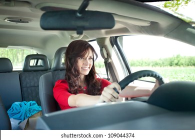 Beautiful Young Girl Driving Car