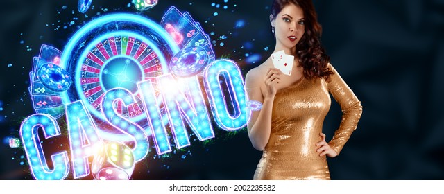A beautiful young girl in a gold dress holds playing cards, neon casino inscription, cards and dice in her hands. Banner concept for casino, poker, flyer, gambling, croupier, header for the site