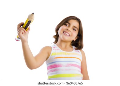 Beautiful Young Girl Holding A Big Pencil And Writing Something On A Glass Wall