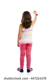 Beautiful Young Girl Holding A Big Pencil And Writing Something On A Glass Wall