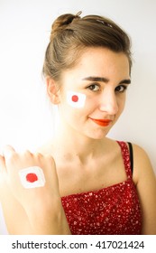 Beautiful Young Girl With Japan Flag On Face & Hand Sport Fan