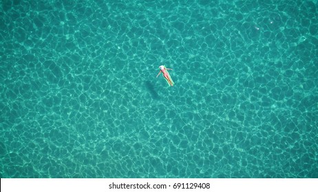 744 Aerial view woman floating clear water Images, Stock Photos ...