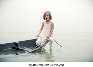 Beautiful Young Girl Is Looking On You From The Sinking Boat. Artistic Toning.