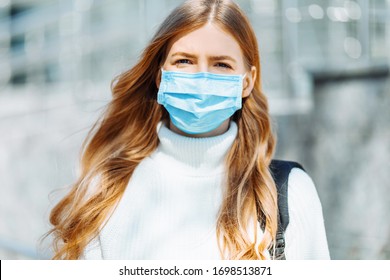 Beautiful Young Girl In A Mask From Coronovirus, Student On The Background Of Educational Envy, Women Returning From Work, Remote Work, Covid-19