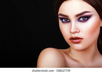 beautiful young girl on a black background with creative makeup, model, makeup, closeup