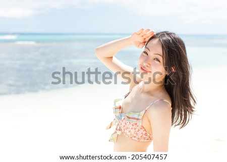 beautiful young girl on tropical island beach