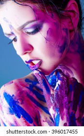 and beautiful young girl with paint on body and hands