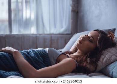 Beautiful young girl is sleeping in bed at home - Powered by Shutterstock