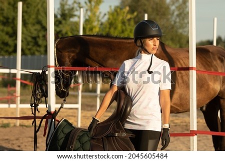 Beautiful young girl smile at her horse dressing uniform competition