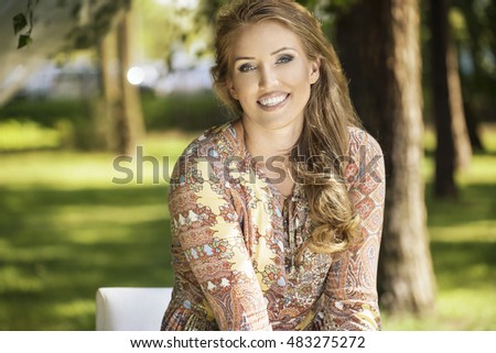 A beautiful young girl smiles, she is happy