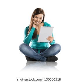 Beautiful young girl with tablet in studio - Powered by Shutterstock