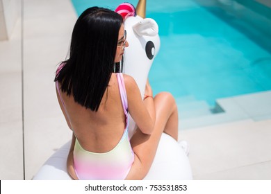 Beautiful Young Girl With Unicorn Float