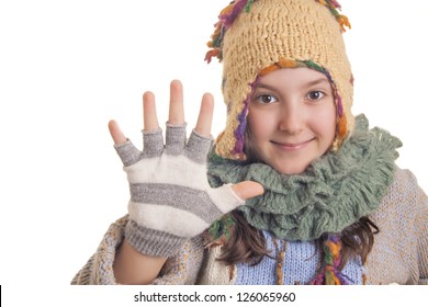 Beautiful young girl in warm winter clothes showing hi five