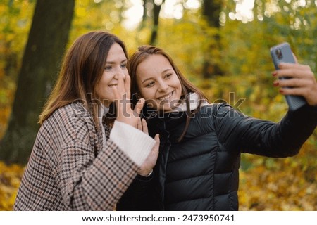 Similar – Happy women embracing and laughing over nature background