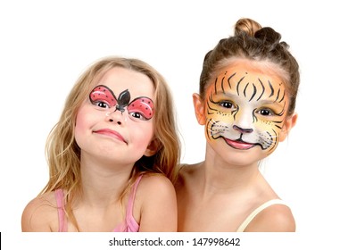 Beautiful young girls with painted faces, tiger and ladybug - Powered by Shutterstock