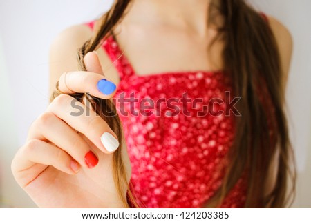 Beautiful young grl hand with painted french flag on hand closeup