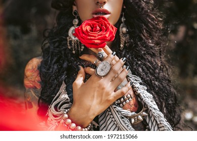 Beautiful Young Gypsy Style Woman With Red Rose Outdoors