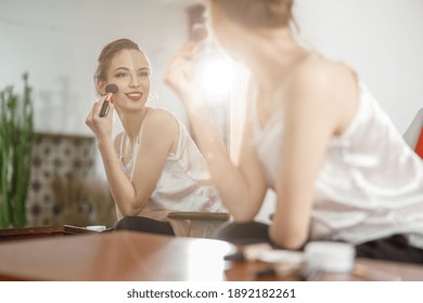 Beautiful young happy caucasian woman at cozy home with cosmetics at sunny morning - Shutterstock ID 1892182261