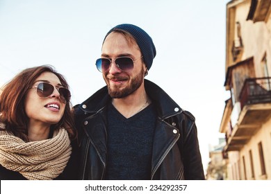 beautiful young and happy couple in sunglasses outdoors closeup