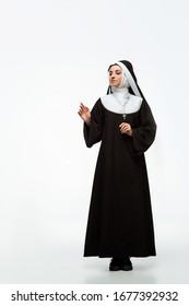 Beautiful Young Happy Nun Standing On White