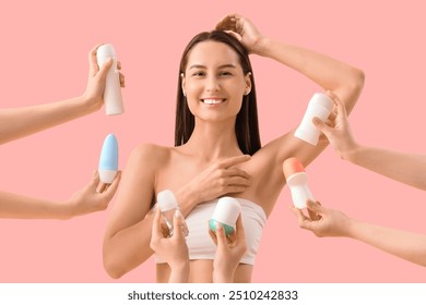 Beautiful young happy woman and hands with different deodorants on pink background