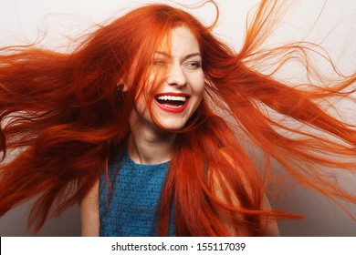 Beautiful Young Happy Woman With Long Flowing Red Hair