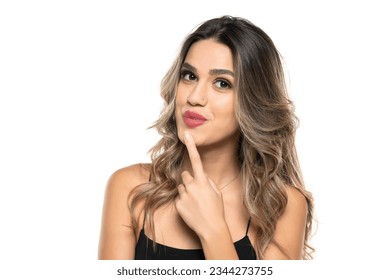 beautiful young happy women with makeup and long wavy hair on a white studio background.
