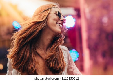 Beautiful Young Hippie Woman Enjoying At Music Festival Outdoors. Woman In Retro Look Dancing At Music Festival.