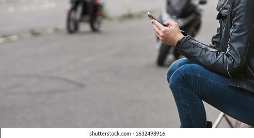 Beautiful young hipster woman using smart phone