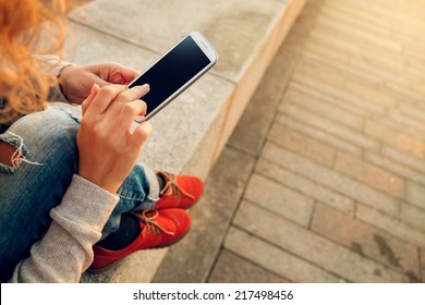 Beautiful young  hipster woman using smart phone at beach
