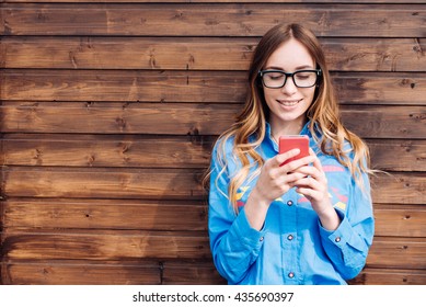 Beautiful Young Hipster Woman Using Smart Phone.