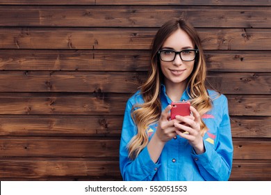 Beautiful Young Hipster Woman Using Smart Phone.