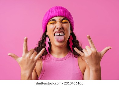 Beautiful young hispanic woman with diastema with colorful and cool style - Confident and interesting female with diverse and unique style, concepts about fashion, individuality and body acceptance - Shutterstock ID 2310456105
